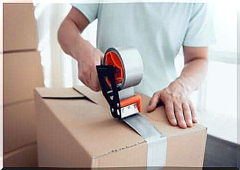 Man packing in boxes to organize the house.