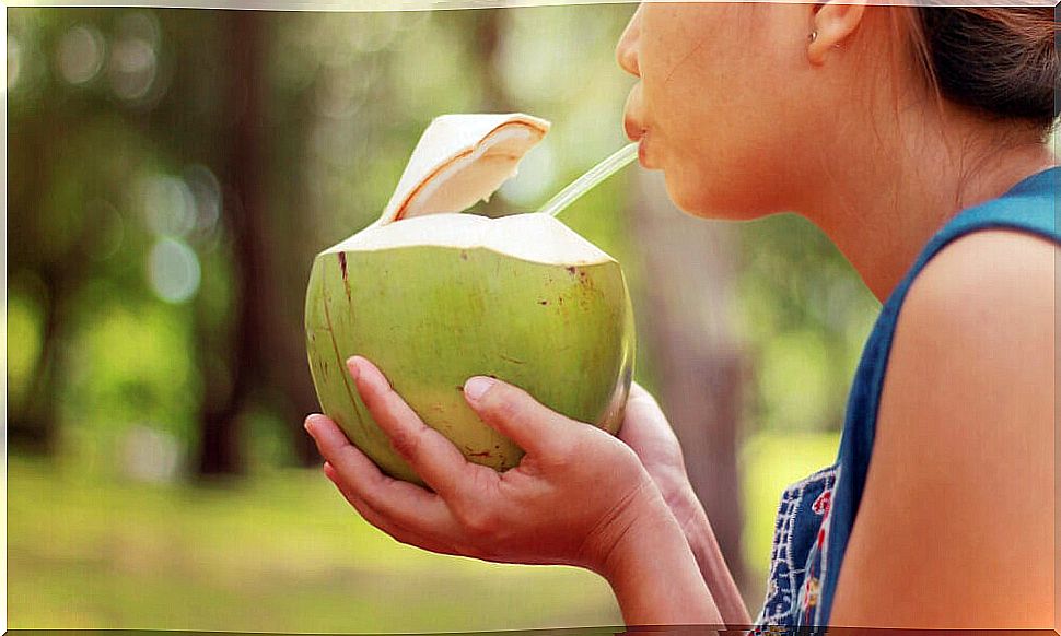 woman drinking coconut water