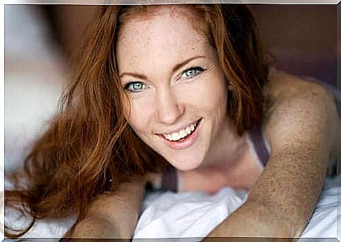 redhead woman smiling