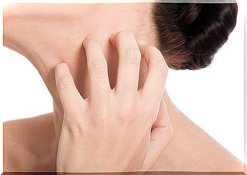 woman scratching her neck