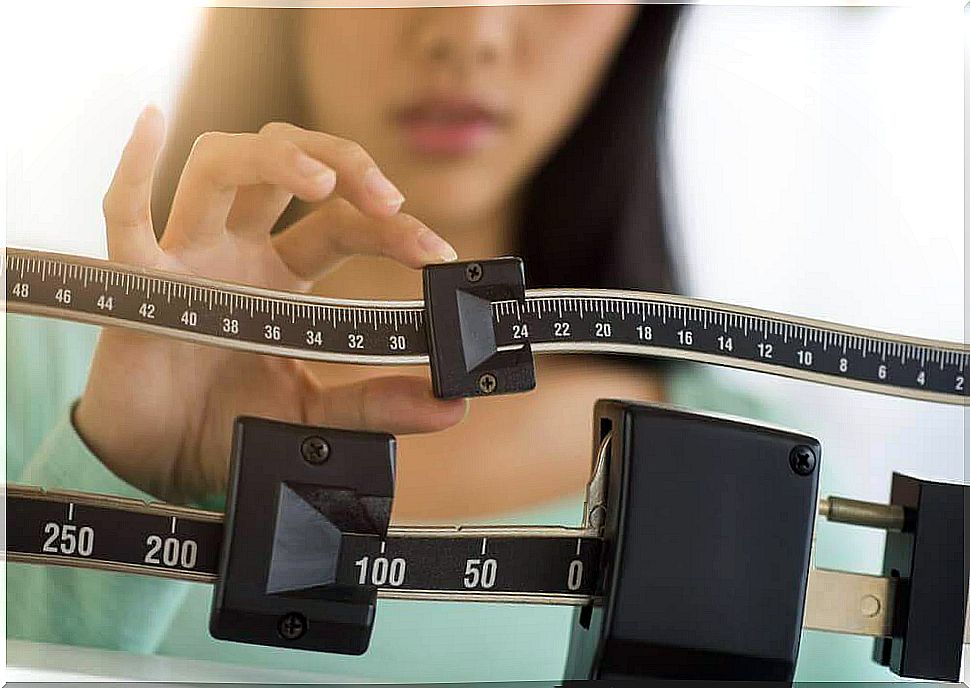 woman weighing herself