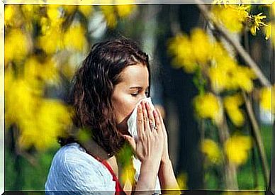 Girl sneezing from pollen allergy