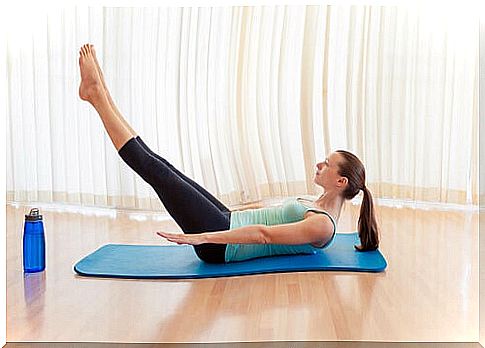 Woman doing exercise to relieve back pain.