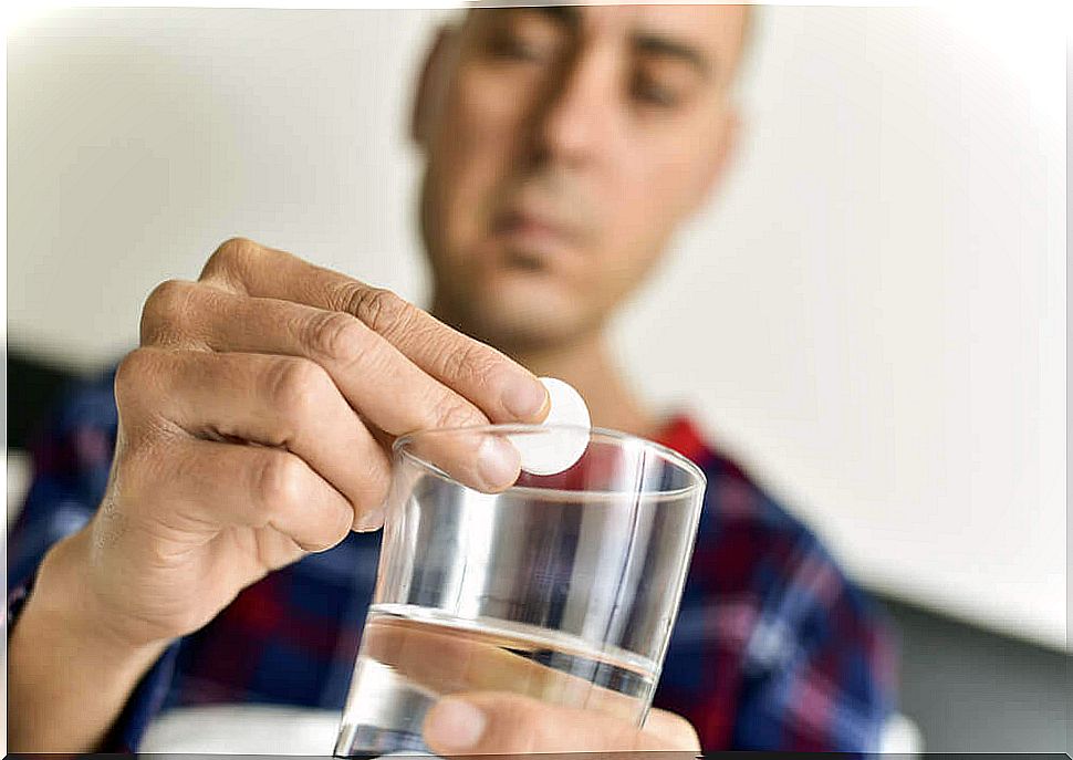 Man taking medicine that can make him fat